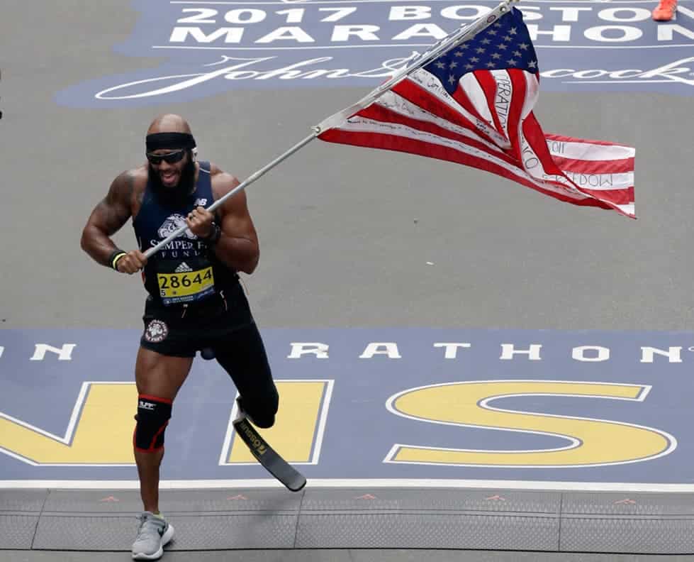 Boston Marathon - Staff Sgt. Jose with the American flag at the finish line