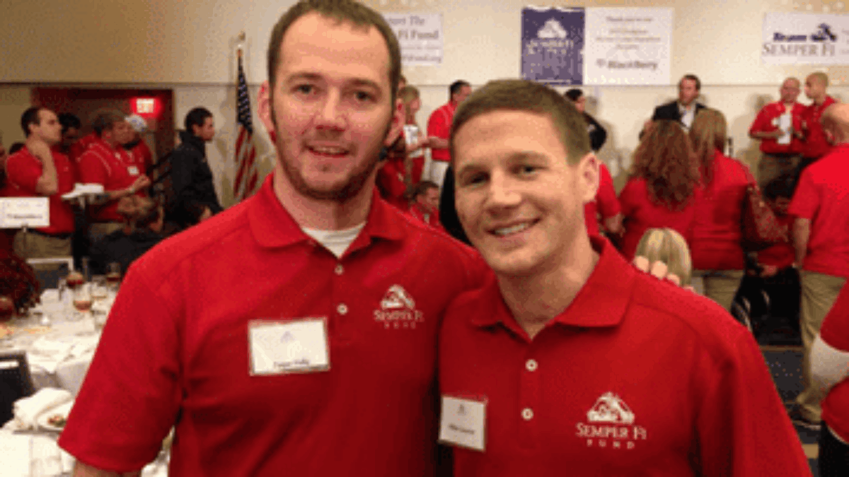 asper H. with Medal of Honor recipient Kyle C., volunteering at a Semper Fi Fund event.