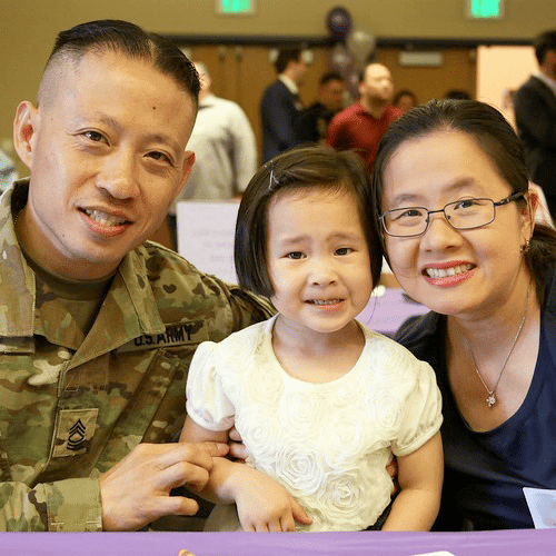 Military family poses at a charity event