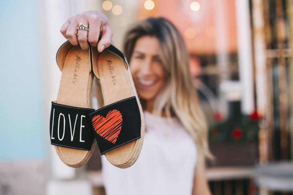 Gabi Nehring women's black sandals, love on the right and a red heart on the left
