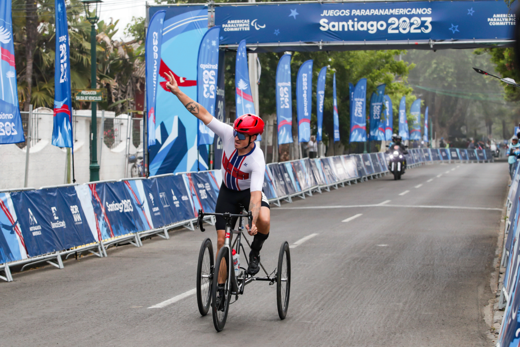 Dennis riding his bike at the olypmics